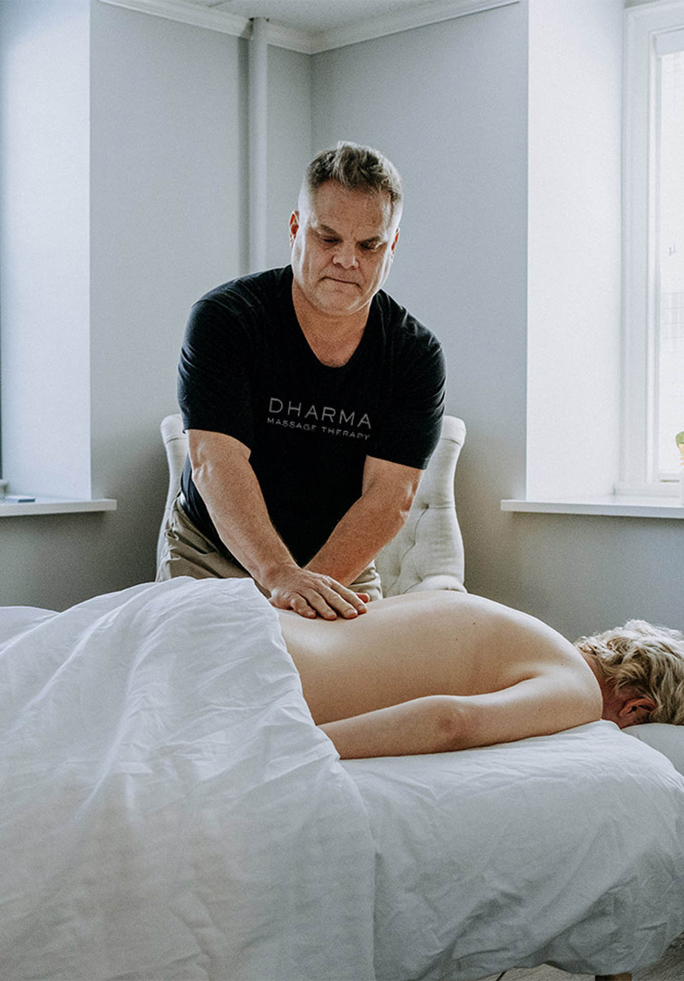mark-people-massage-services-new Massage therapist Mark massaging a woman on a table